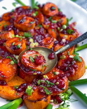 platter of roasted sweet potatoes with cranberries