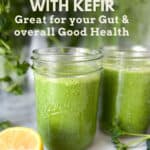 two viviv green smoothies in mason jars, surrounded by kale and parsley and half a lemon.